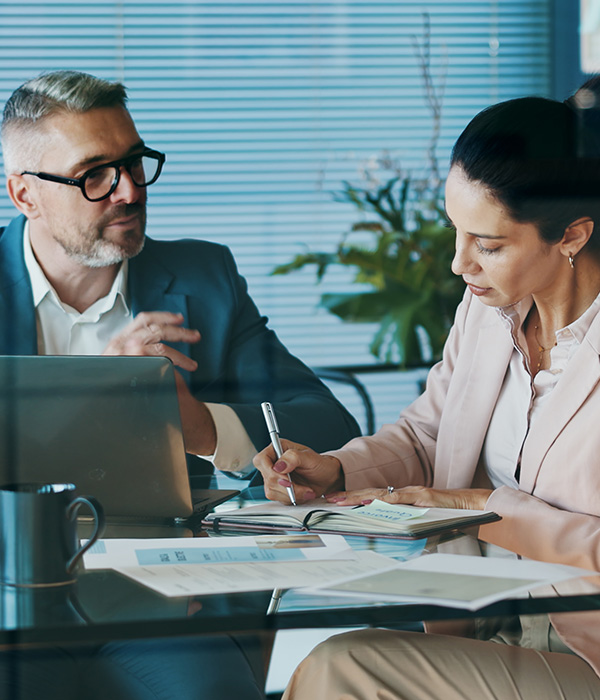 Documents, laptop and business people in office with meeting for company investment deal