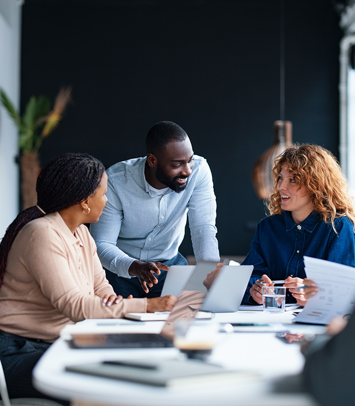 A group of colleagues working together in a contemporary office environment